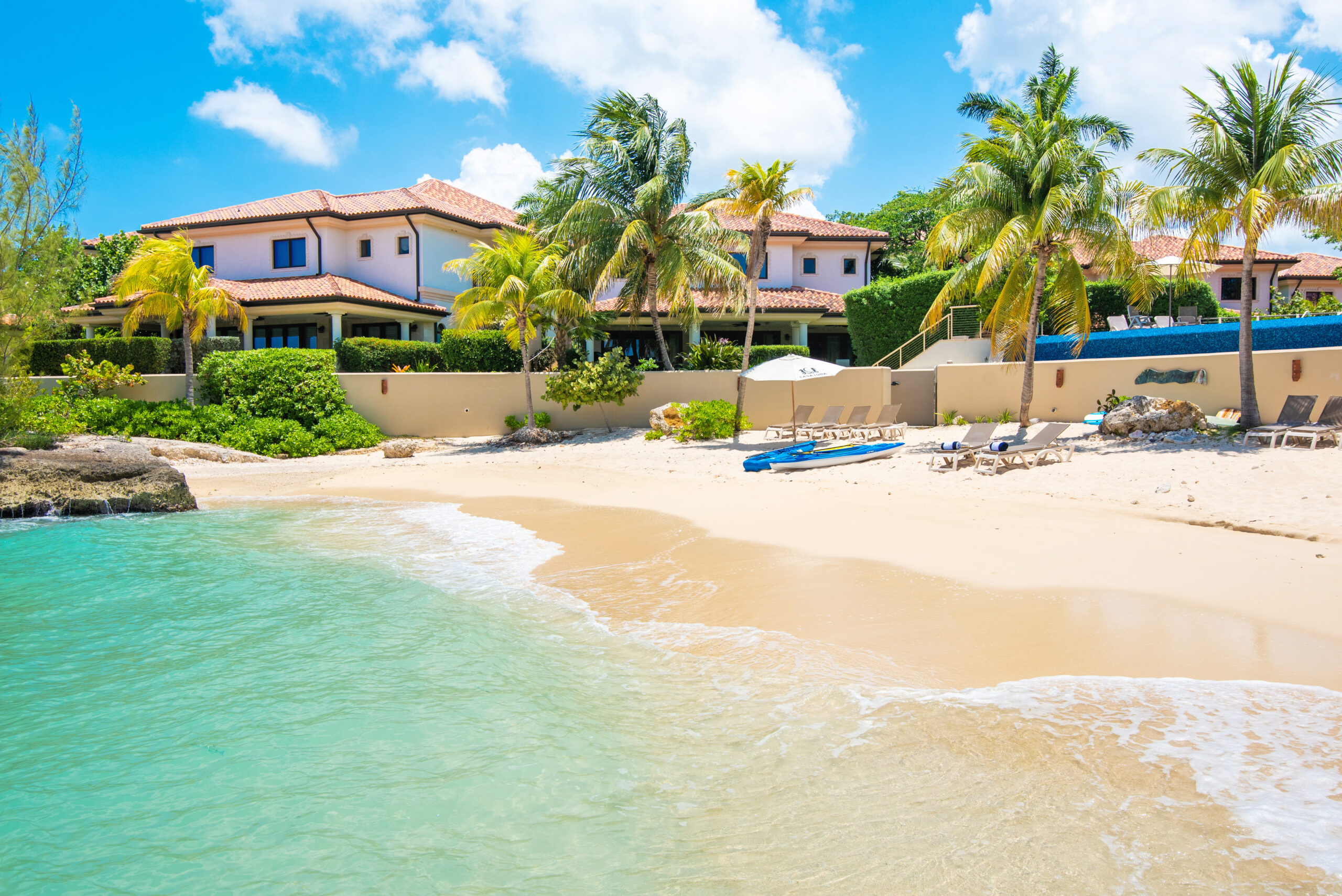 Casa Luna Grand Cayman — Mediterranean-style oceanfront villas with a private beach cove, infinity pool on Seven Mile Beach